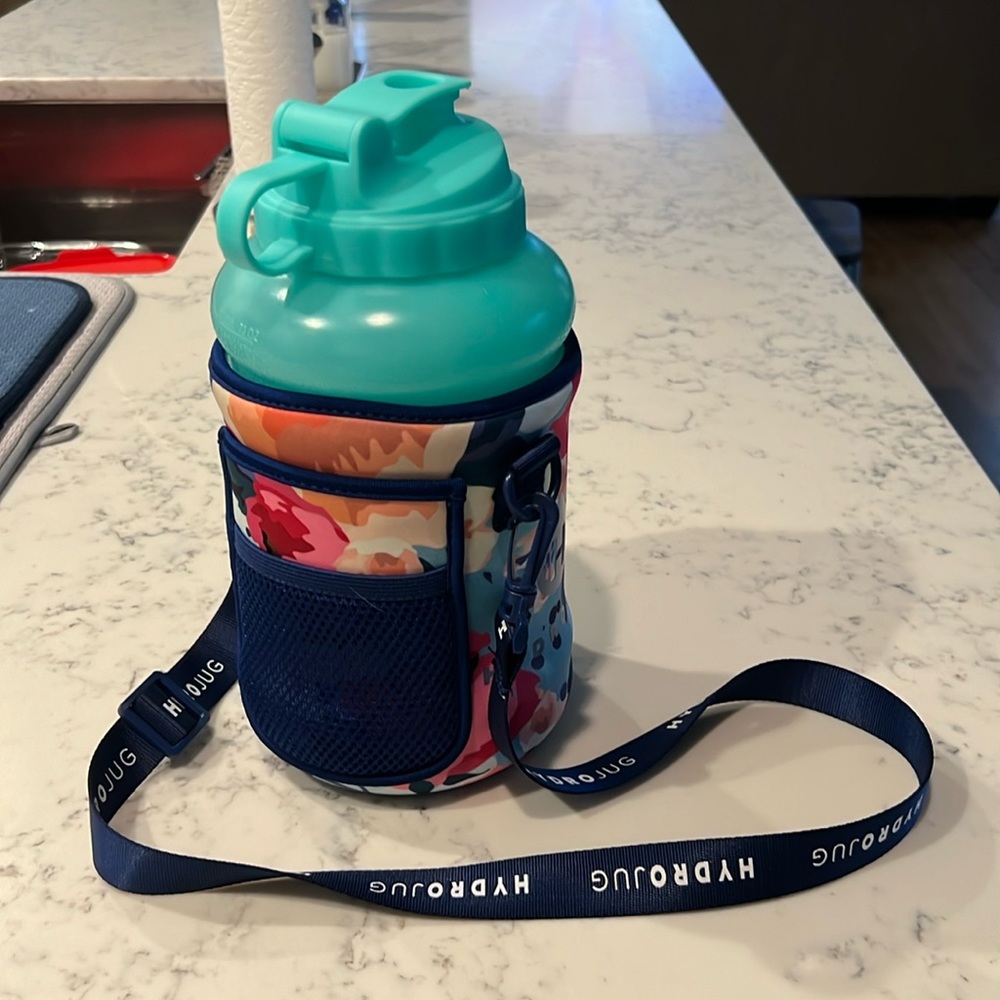 Turquoise hydrojug with floral sleeve